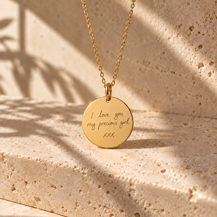 Gold handwriting necklace engraved with a handwritten note