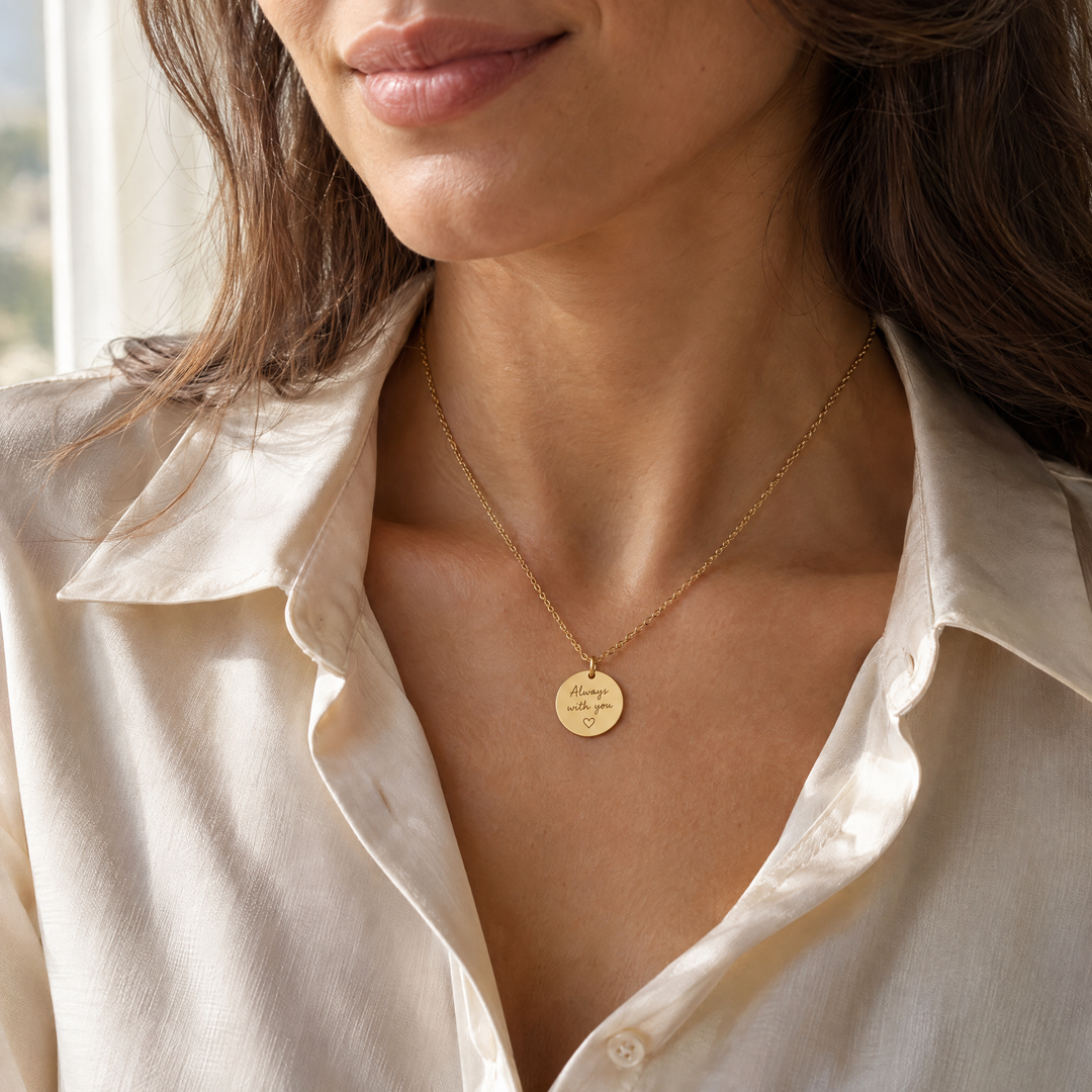 Woman wearing a gold handwriting necklace