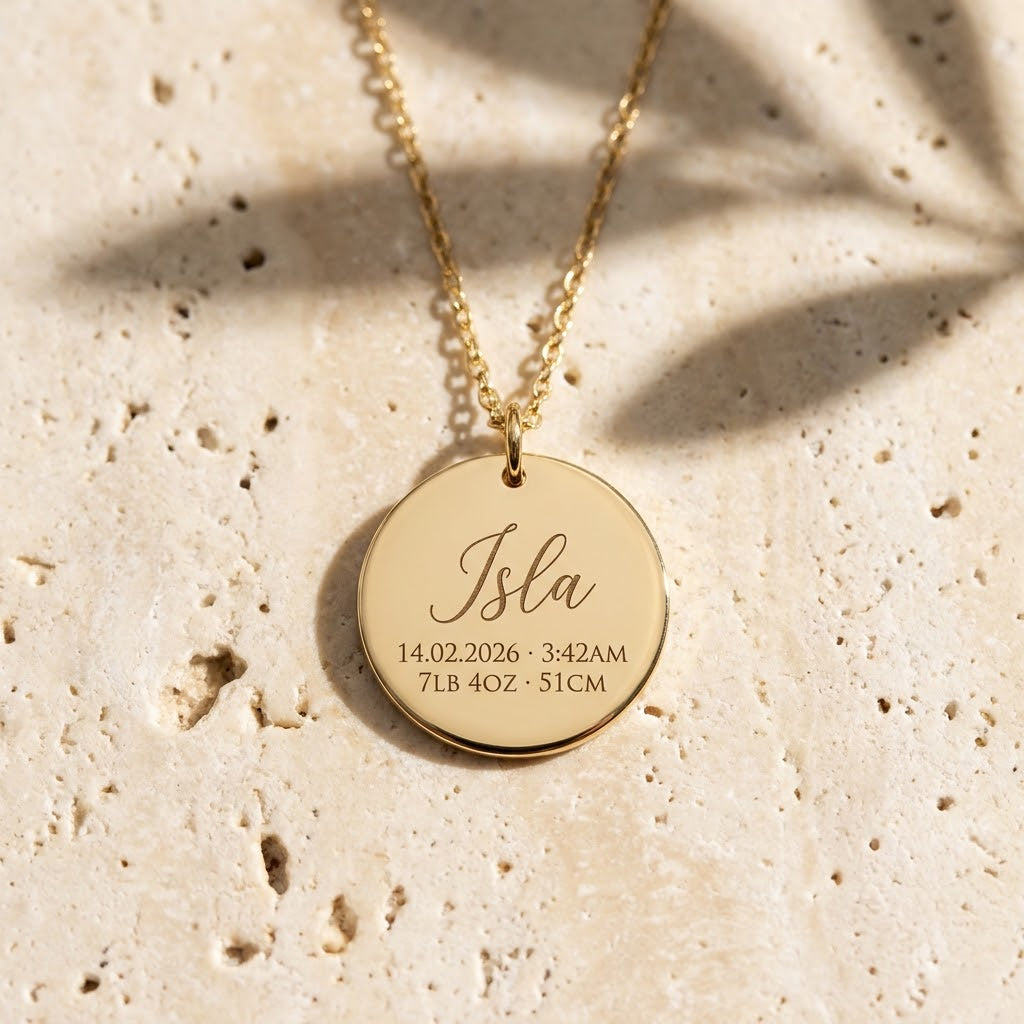 Gold new mum necklace engraved with baby name Isla and birth details