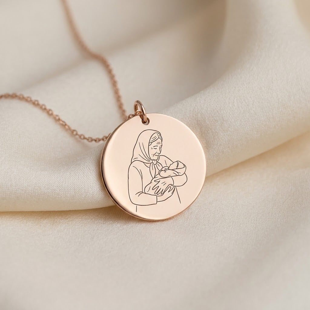 Rose gold photo necklace engraved with a grandmother holding a baby